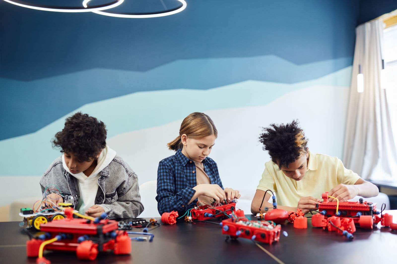 Young technologists experimenting with a prototype together